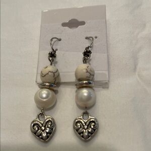 Brighton earrings with gold colored hangers silver hearts white shells and balls